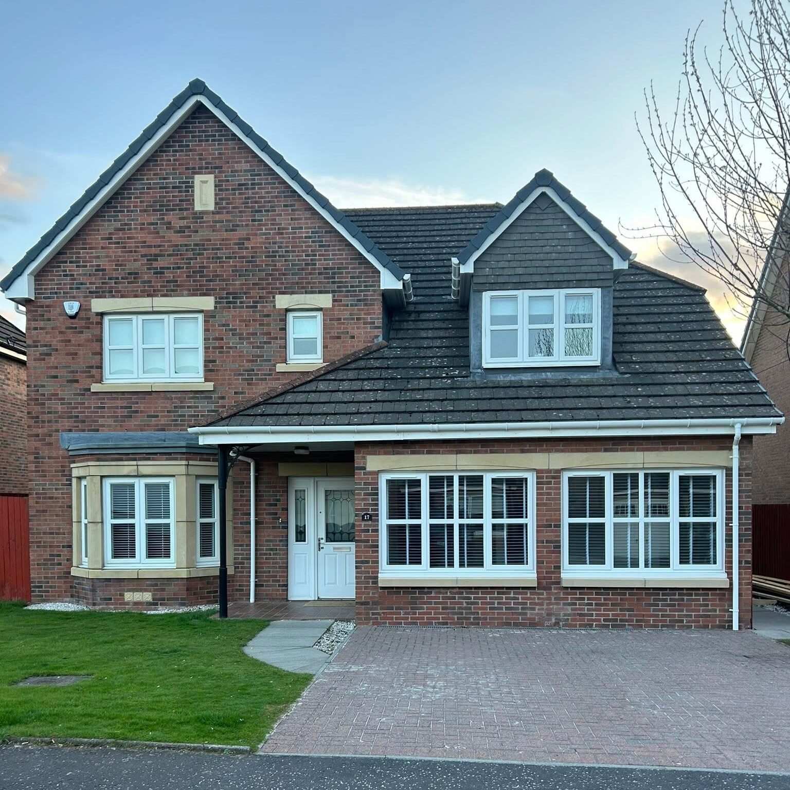 secure uPVC front door installed on brick house